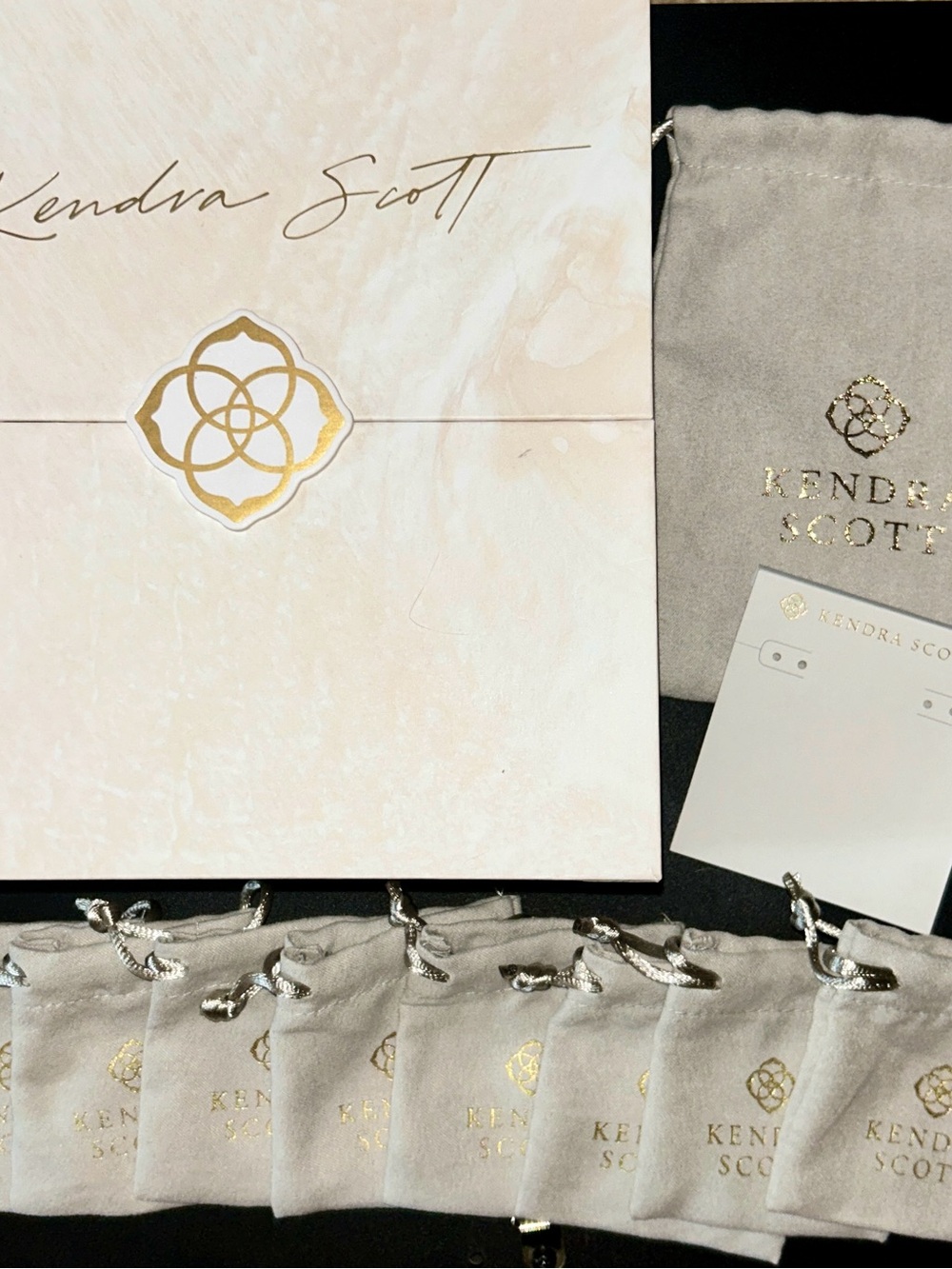 Kendra Scott dust bags, earring card, and advent calendar